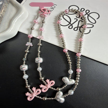 Mehrsträngige Perlenkette mit Charms Brehn