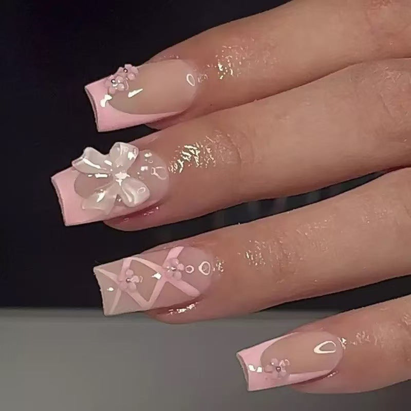 Kunstnagelset mit filigranen 3D-Blüten und Schleifen Brehn
