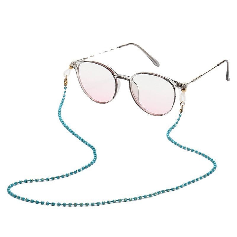 Modische Katzenaugenbrille mit Perlenkette Brehn