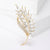 Elegante Brosche mit Glitzerstein und Perle Brehn