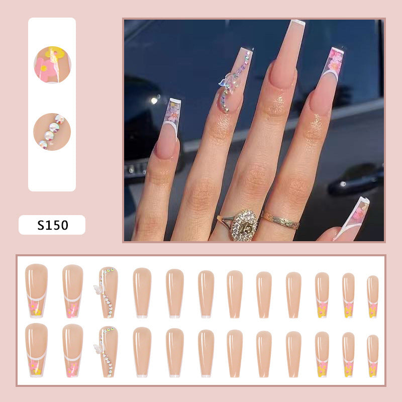 Kunstnagelspitzen im eleganten französischen Design mit floralem Akzent Brehn