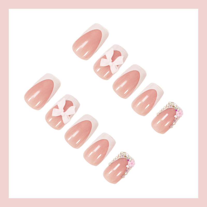 Kunstnagelset mit eleganten Schleifen- und Glitzerdesigns Brehn