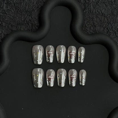Dekorative Schleifen-verzierte Press-On Nagelkunst