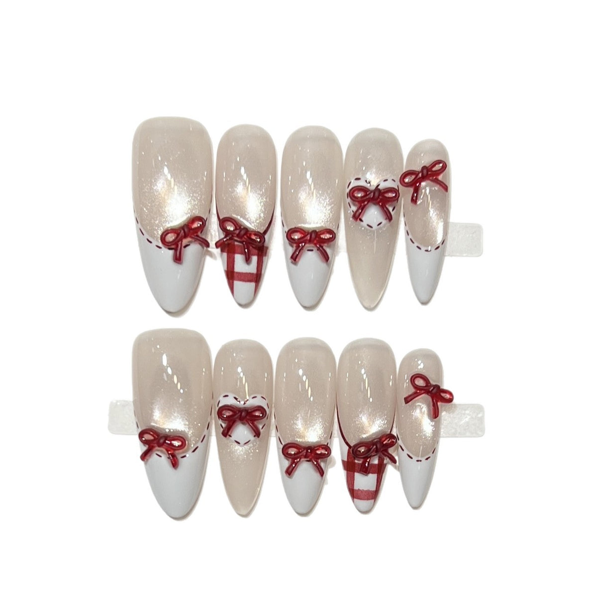 Dekorativer Stiletto Press-On Nagelset mit Schleifenakzenten Brehn