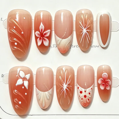 Kunstnagelset mit floralen Akzenten und elegantem Ombre-Effekt Brehn
