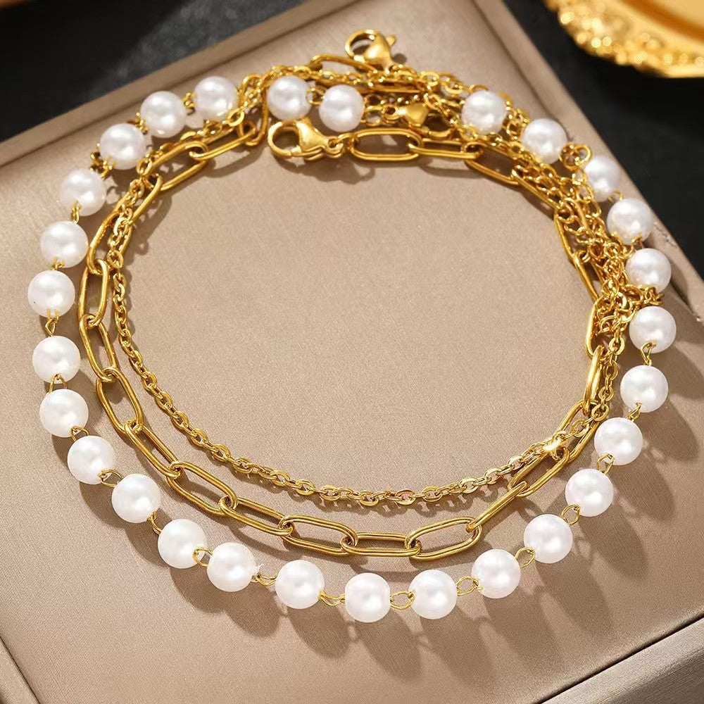 Elegantes Schichten Perlen- und Kettenarmband-Set Brehn