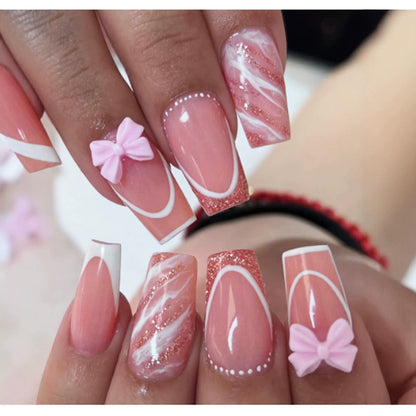 Kunstnagelset mit elegantem Glitzer-Design und verspielten Schleifen akzenten Brehn