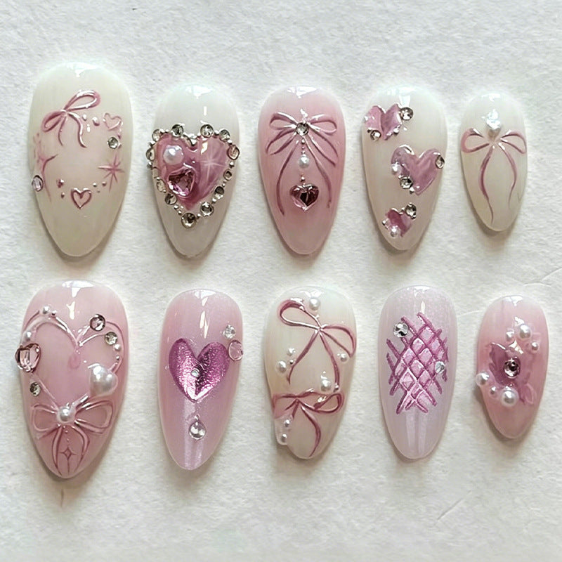 Kunstnagelset mit romantischen Schleifen- und Herzdesigns Brehn