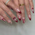 Kreatives Nagelset mit romantischen Herz- und Schleifenakzenten Brehn