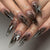 Kunstnagelset mit eleganten floralem Design und funkelnden Akzenten Brehn