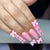 Kunstnagelset mit romantischen Schleifen- und Glitzerakzenten Brehn