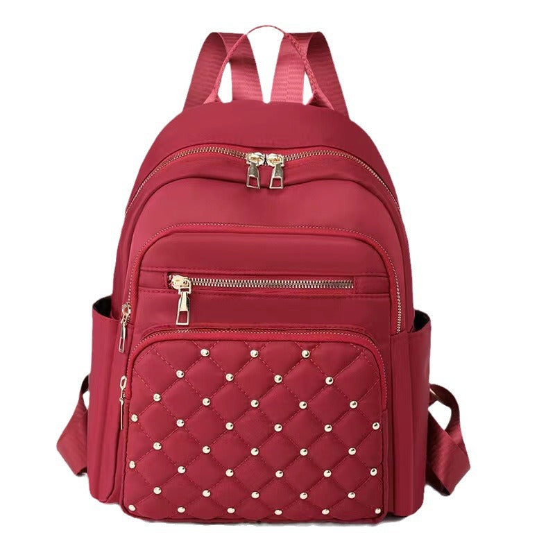 Quilted Rucksack mit dekorativen Nieten Brehn
