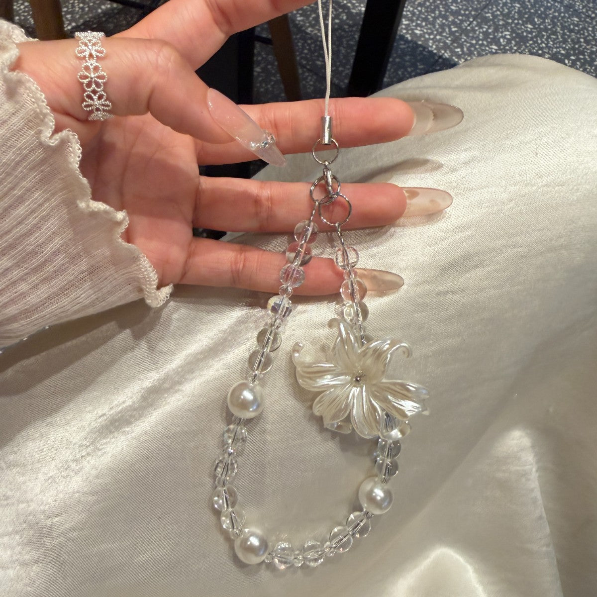 Blumen Perlen Charm Handyband Brehn