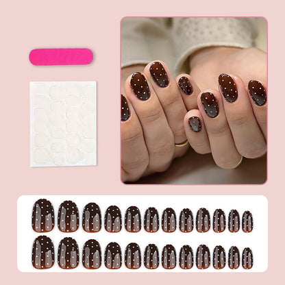 Kunstnagelset mit eleganten Punkten und glänzenden Akzenten Brehn
