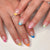 Kunstnagelset mit buntem French Design Brehn