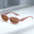 Damen modische Sonnenbrille mit stilvollem, geschwungenem Rahmen Brehn