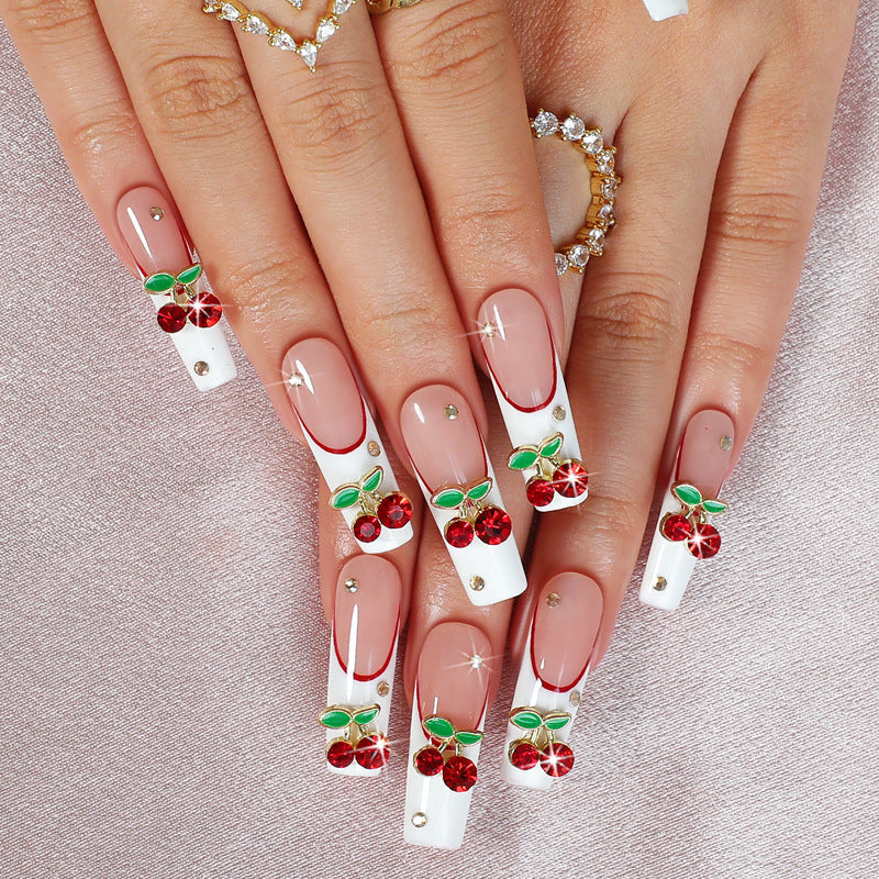 Kunstnagelset mit Kirschmotiv und funkelnden Strasssteinen Brehn