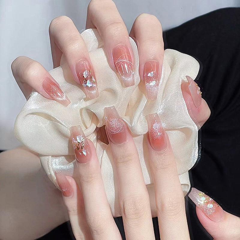 Kunstnagelset mit eleganten Glitzer- und Blumendekoren Brehn