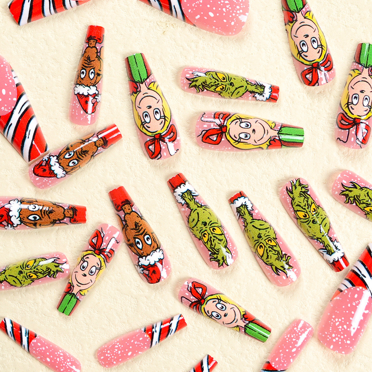 Kunstnagelset mit festlichen Motiven und charmantem Grinch Design Brehn