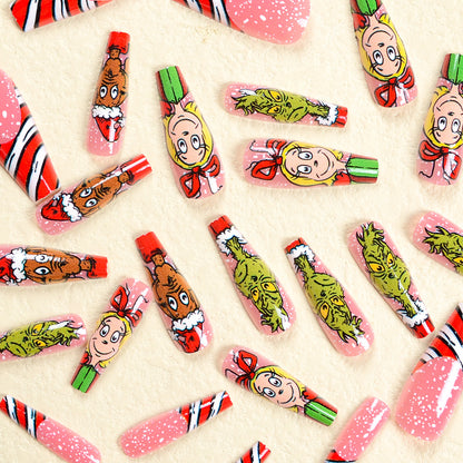Kunstnagelset mit festlichen Motiven und charmantem Grinch Design Brehn
