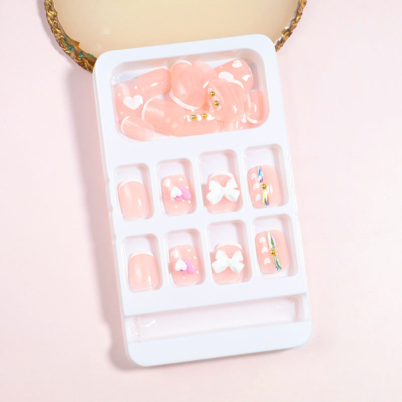 Dekorativer Press-On Nail Art Set mit Schleifenakzenten Brehn