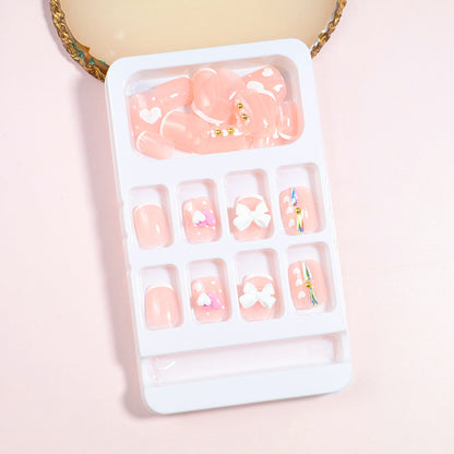 Dekorativer Press-On Nail Art Set mit Schleifenakzenten Brehn