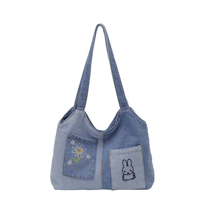 Künstlerisch bestickte Denim-Handtasche