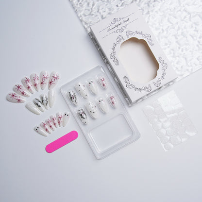 Kunstvolles Nagelset mit Edelstahl-Applikationen Brehn