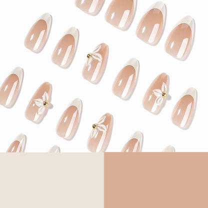 Kunstvolle Stiletto-Nägel mit elegantem Blumendesign Brehn