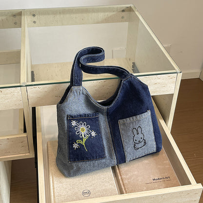 Künstlerisch bestickte Denim-Handtasche