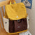 Stylische Mehrfachtaschen-Schnürsenkel-Rucksack