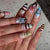 Kunstnagelset mit floralen und geometrischen Designs Brehn