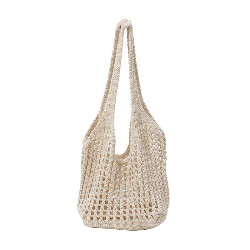 Blumenverziertes gehäkeltes Tote
