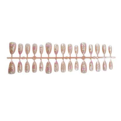 Dekoratives Press-On Nagelkunst-Set mit floralen und metallischen Akzenten