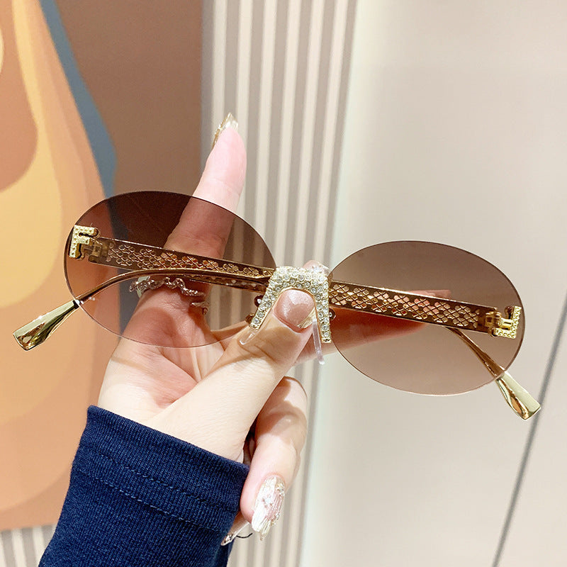 Damen Sonnenbrille mit glitzerndem Rahmen und ovalen Gläsern Brehn