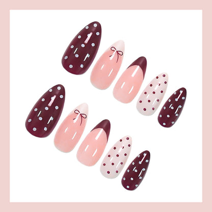 Kunstnagelset mit eleganten Schleifen- und Punktemotiven Brehn