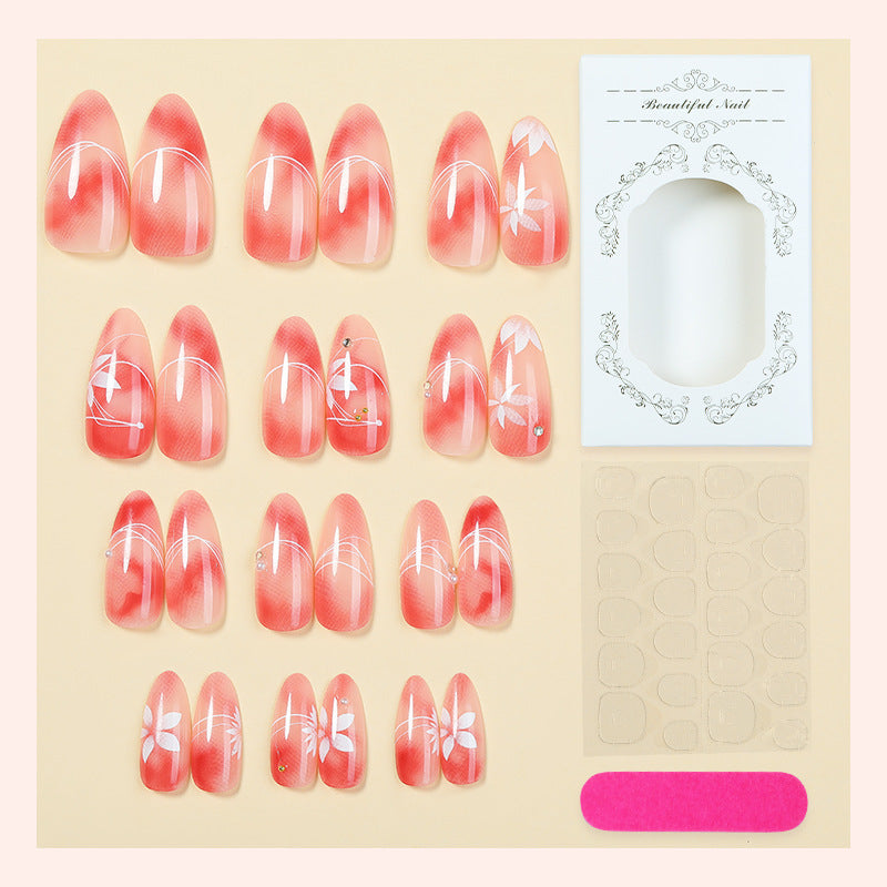 Kunstnagelset mit elegantem Ombre-Design und floralem Akzent Brehn