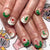 Kunstnagelset mit weihnachtlichen Motiven und Glitzerakzenten Brehn