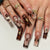 Kunstnagelset mit floralen Akzenten und Glitzerakzenten Brehn