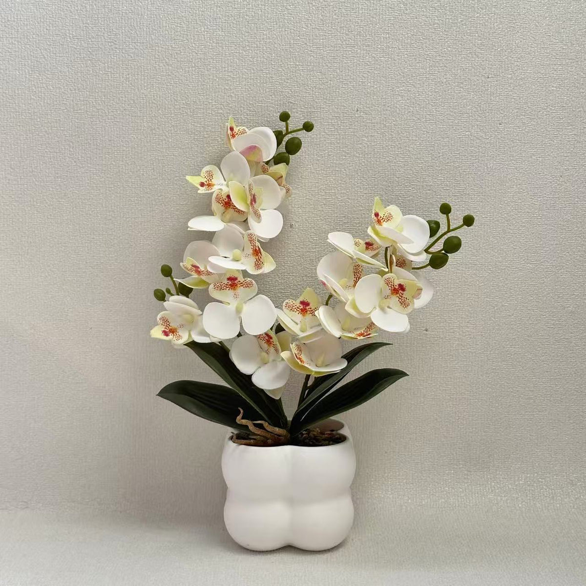 Lebensechte Orchideen Tischmittelstück