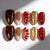 Kreatives Kunstnagelset mit bunten Designs und verschiedenen Texturen Brehn