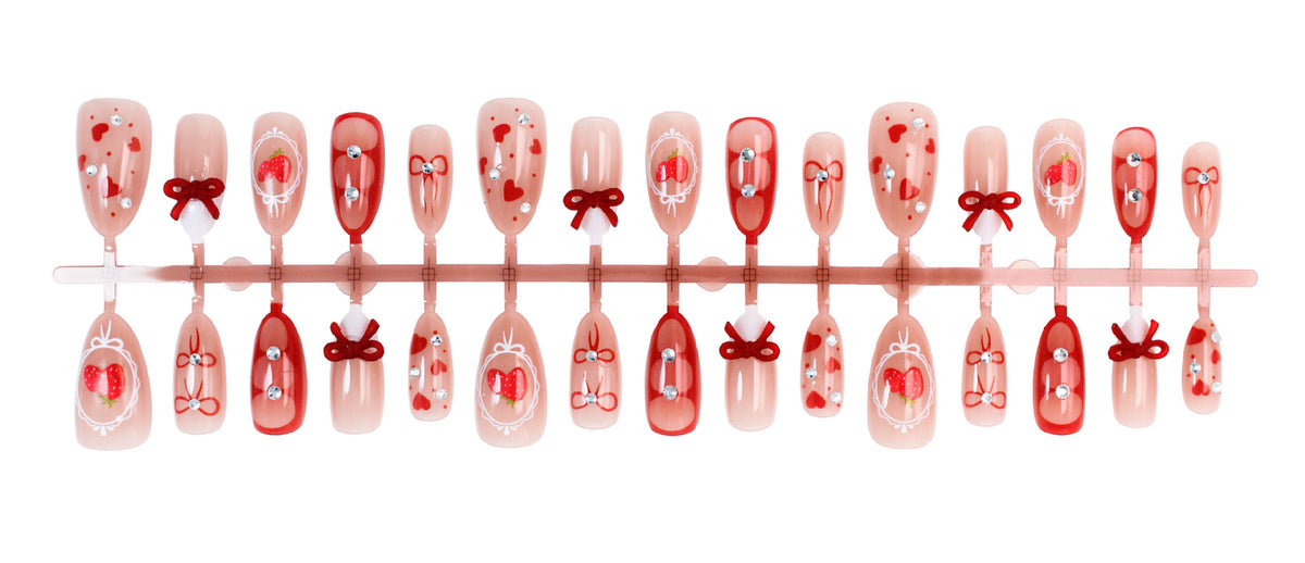 Kunstnagelset mit niedlichen Herz- und Schleifenmotiven Brehn