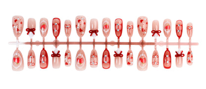 Kunstnagelset mit niedlichen Herz- und Schleifenmotiven Brehn