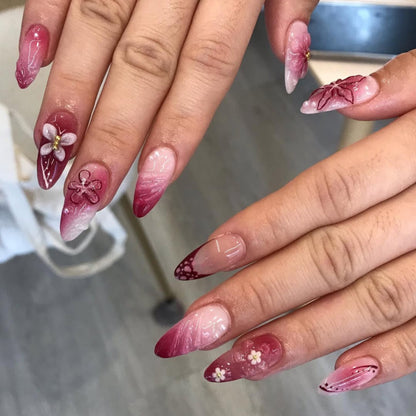 Kunstvolle Nagelverlängerungen mit floralen Details und Ombre-Effekt Brehn