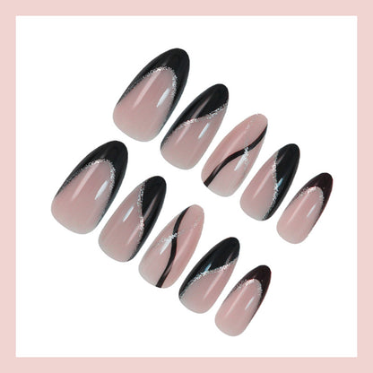 Kunstnagelset mit elegantem Schwarzweiß-Design und Glitzerakzenten Brehn
