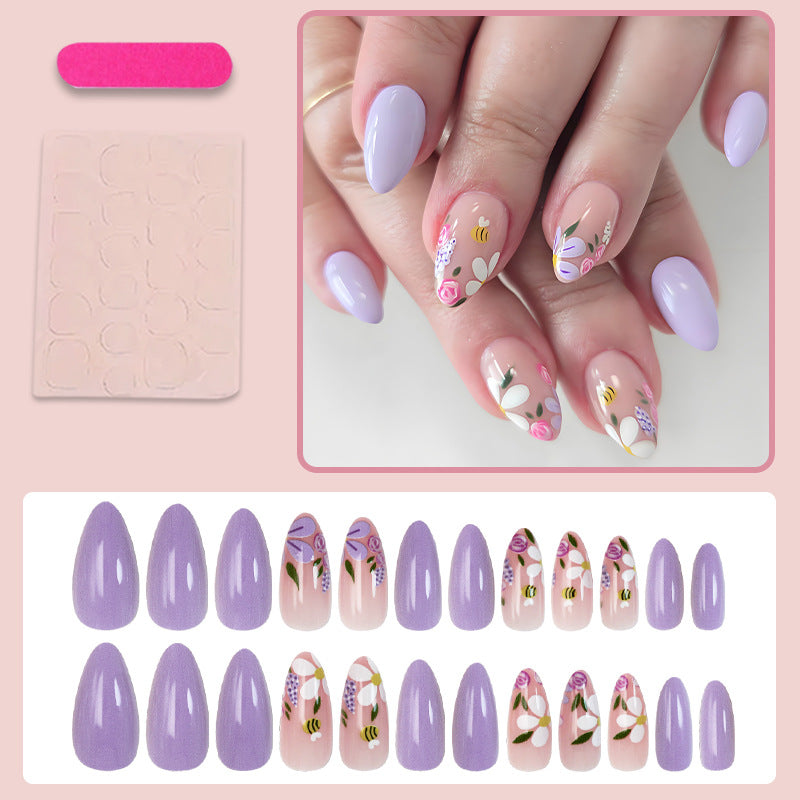 Kunstnagelset mit verspielten Blumen- und Bienenmotiven Brehn