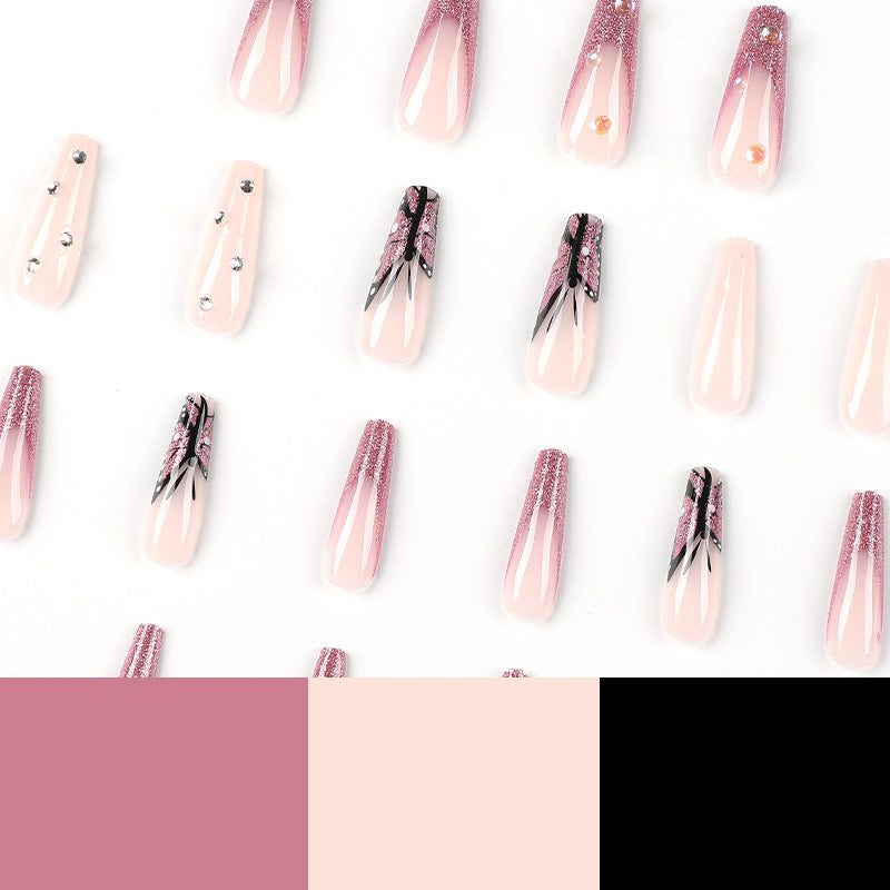 Kunstvolle Stiletto-Nägel mit floralen und glitzernden Akzenten Brehn