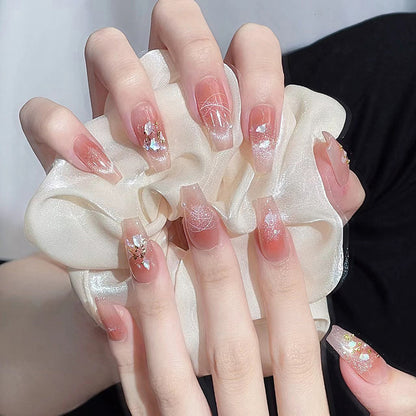 Kunstnagelset mit eleganten Glitzer- und Blumendekoren Brehn