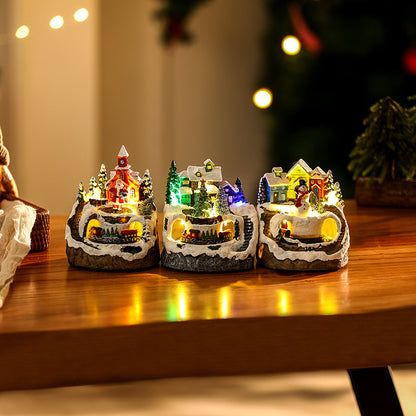 Beleuchtete Weihnachtsdorf-Szene mit Schneemann Brehn