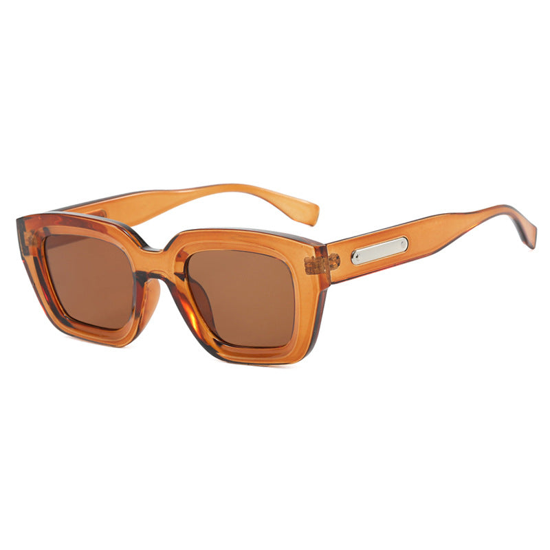 Damen quadratische Sonnenbrille mit transparentem Rahmen und braunen Gläsern Brehn